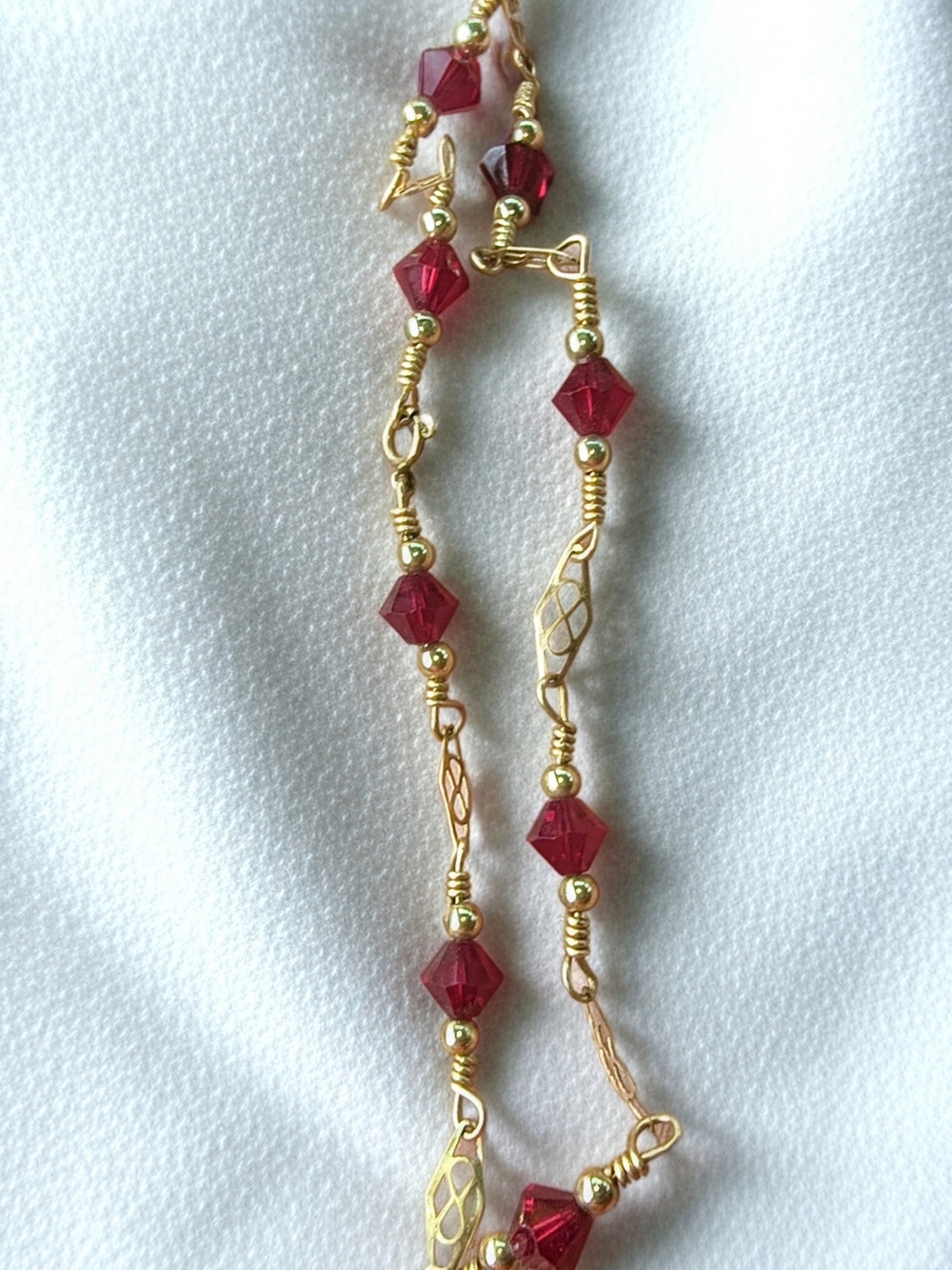 Gold-Tone Bracelet with Faceted Ruby-Red Beads